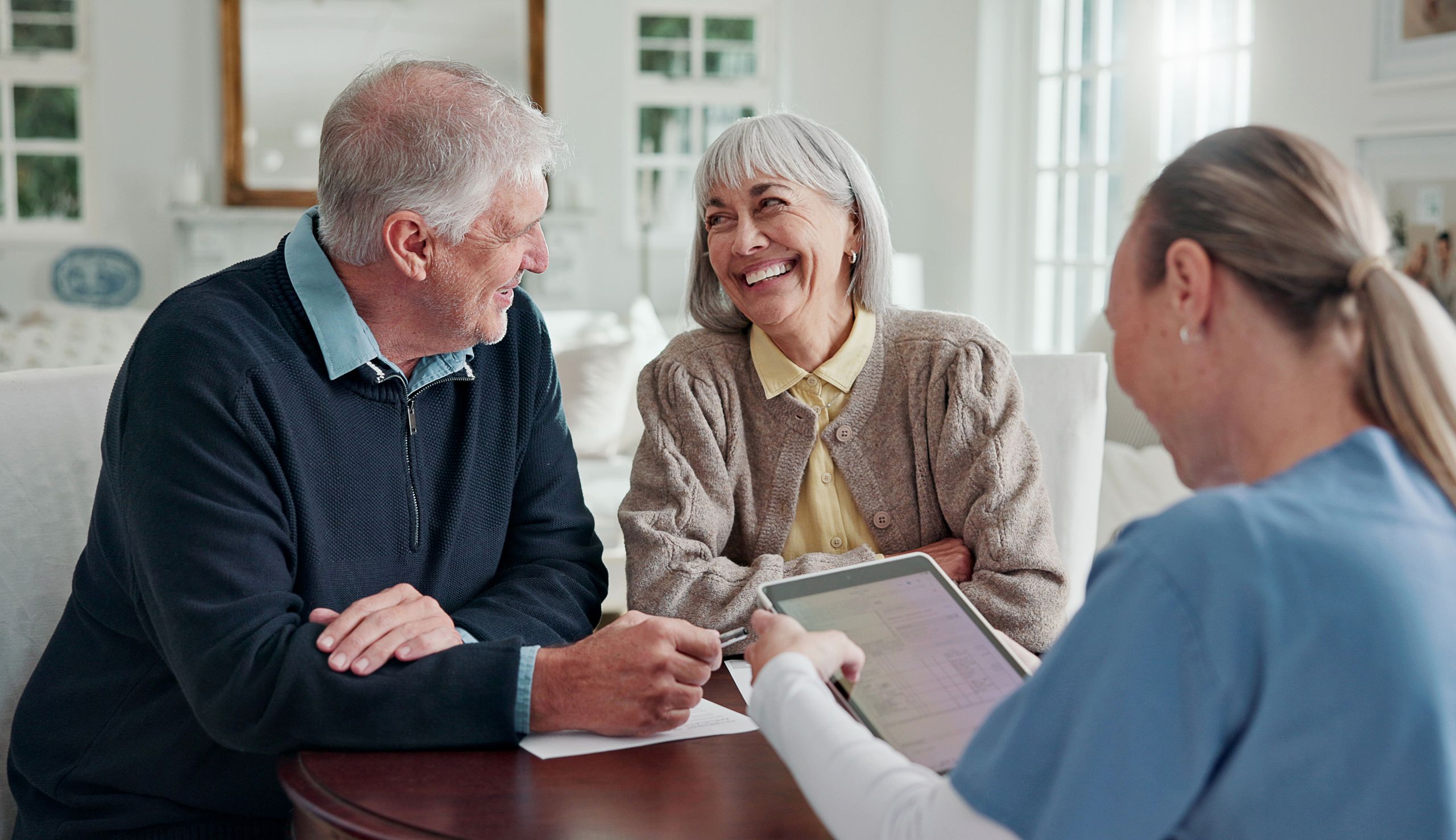 5 Things to Know About Funeral Insurance Happy, old couple and caregiver in home