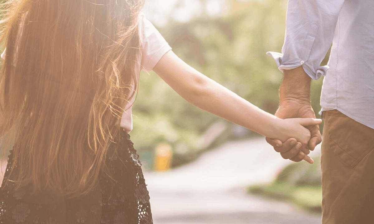 Family holding hands.